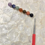 Image of pointer with 7 different colors of topper options.